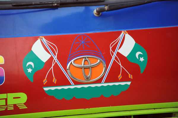 Flags of Pakistan on the front of a bus