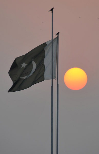 Sunset with the Pakistani flag, Lahore
