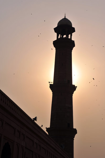 Minaret with the late afternoon sun and hazy sky
