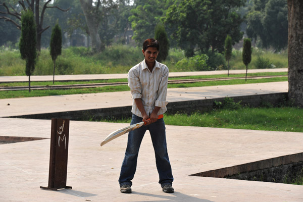 Playing cricket in the garden of Jahangir's Tomb