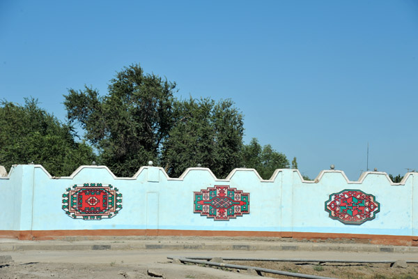 3 of the 5 regional symbols used on the Turkmenistan flag