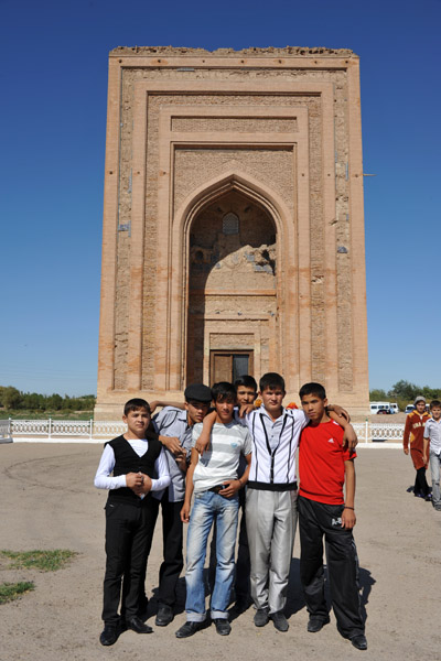 Turkmen guys in front of the Mausoleum of Turabeg Khanym