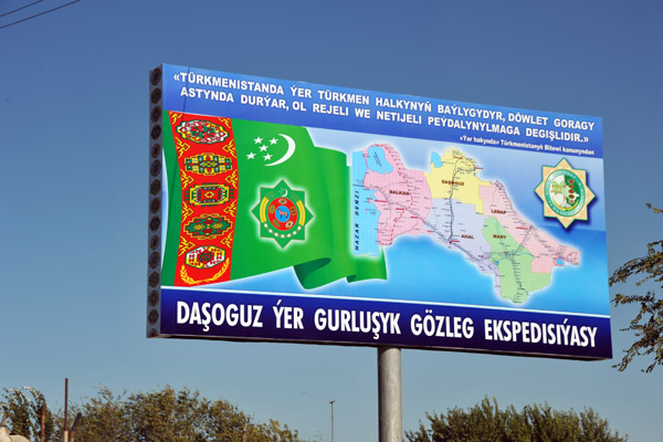Billboard with Turkmenistan flag and map showing the 5 regions