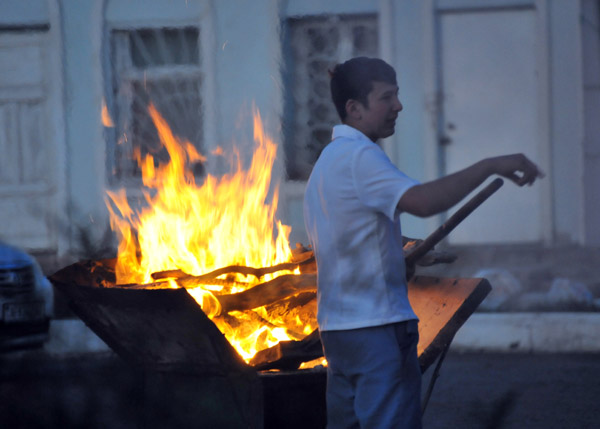 Getting the fire ready to grill kebabs