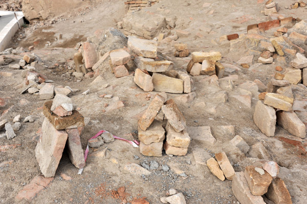 Local people construct these little brick piles for luck