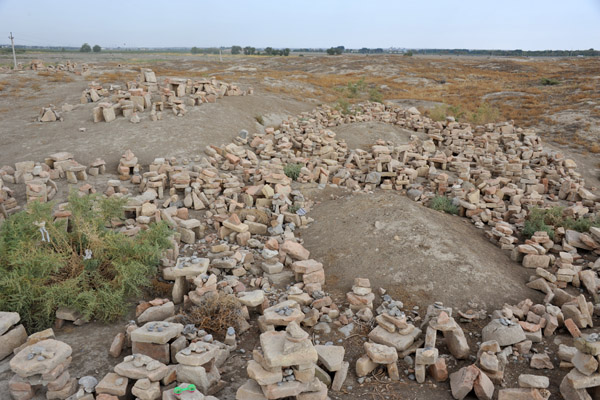Piles of bricks around what are thought to be burial mounds