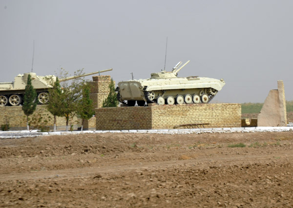 Roadside monument with armored vehicles outside Tejen, Turkmenistan