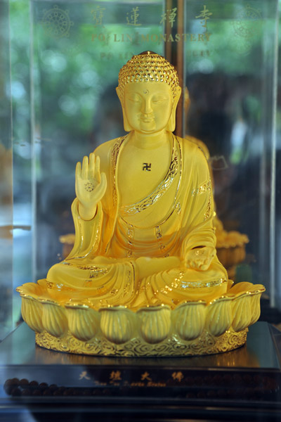 Gold trimmed miniature of the Big Buddha of Lantau Island