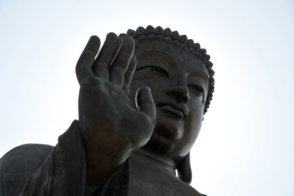 The raised right hand of the Buddha represents the removal of affliction