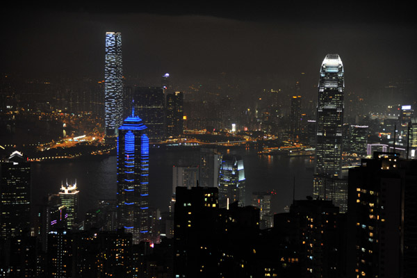 Prominent buildings at night are the Center, Hong Kong IFC and Kowloon's International Commerce Centre