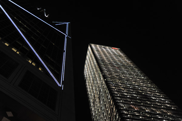 Cheung Kong Center at night with part of the Bank of China Tower