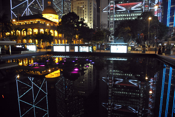 Hong Kong Legislature at night with reflections of the bank towers