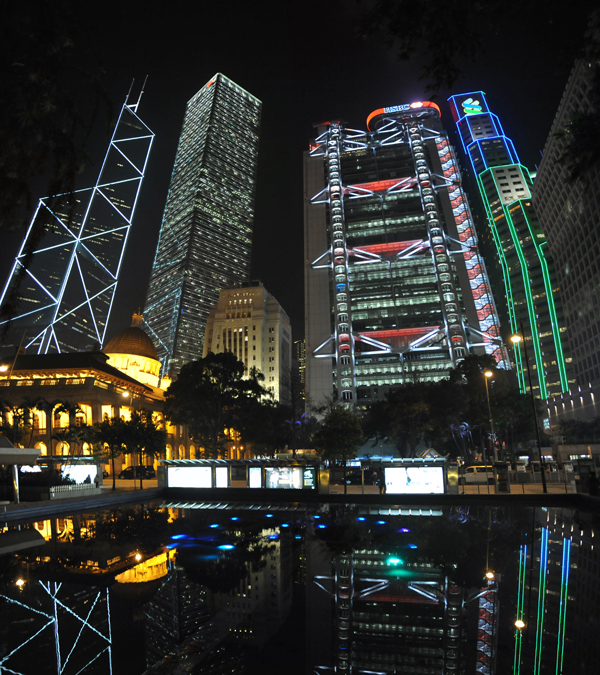 Panoramic photo with the Hong Kong Legislative Council Building and bank towers at night