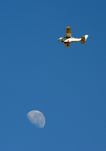 Cessna with the moon, Botswana
