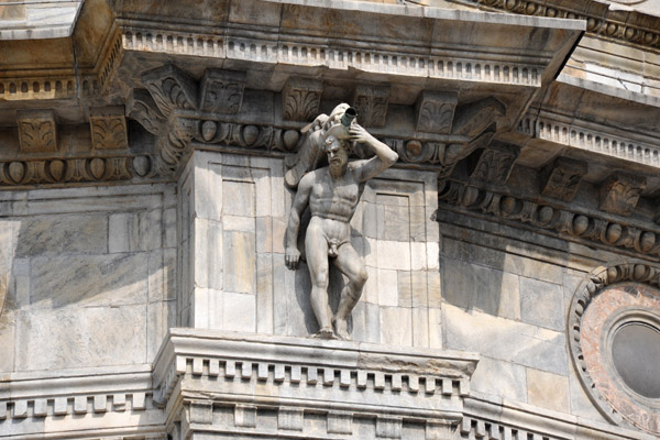 Male nude holding up a dragon water spout, Como Cathedral