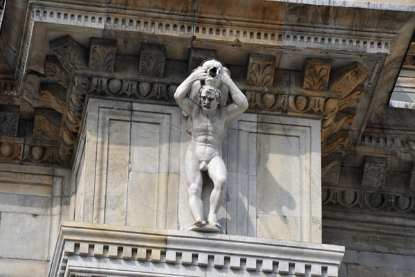 Male nude holding up a dragon water spout, Como Cathedral