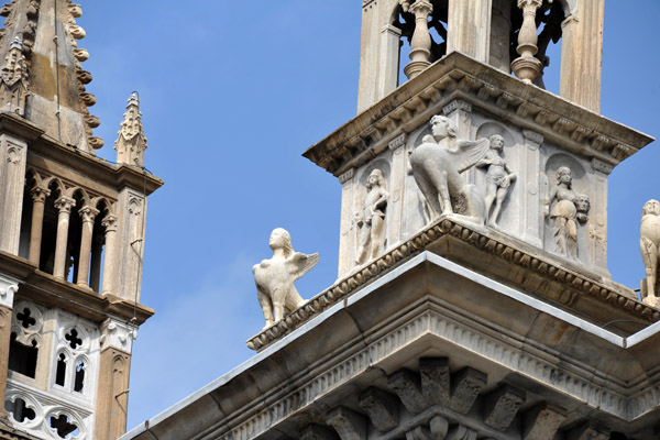 Detail of Como Cathedral spire decorated with sphinxes 