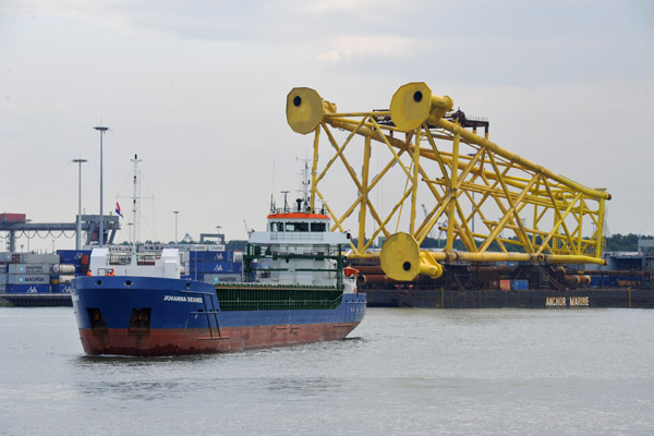 Johanna Desiree and barges with giant yellow towers, Port of Rotterdam