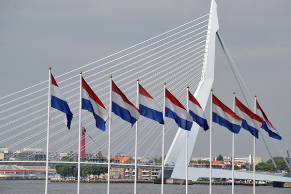 Erasmus Bridge with flags of the Netherlands on Katendrecht