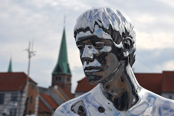 The mirrored surface of the sculpture changes to reflect the mood of the Danish weather
