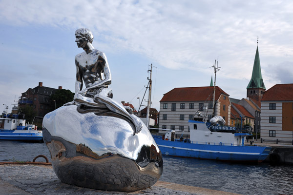 Han on his rock with the city of Helsingr