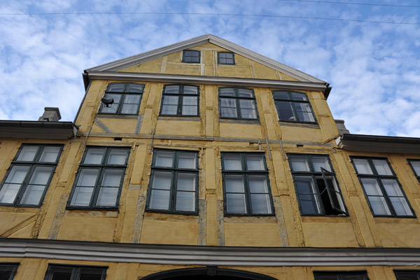 Old timbered house with the beams painted the same as the rest