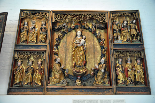 Virgin Mary as Queen of Heaven encircles by a wreath of Apostles & flanked by 12 saints, North Germany, 1518 