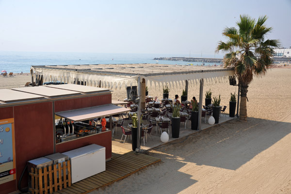 The beaches of Barcelona are lined with little restaurants and beach bars like this