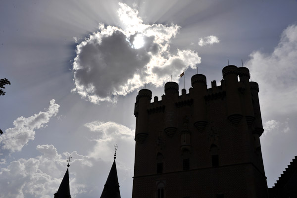 Cloud blocks out the sun with the Torre de Juan II