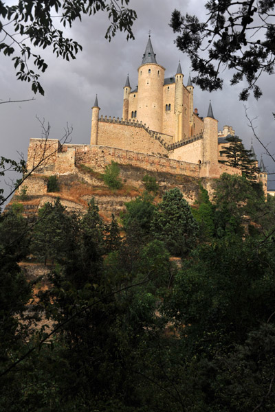 Alczar of Segovia through the trees