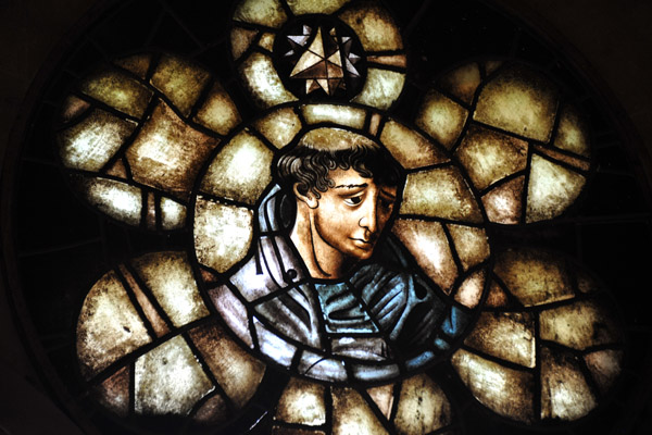 Stained glass window of a monk in the Gallery Chamber