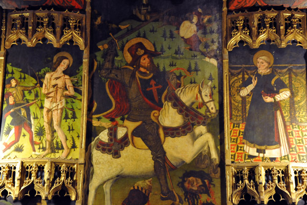 Side altar in the Alcazar Chapel with St. Sebastian on the left, St. James Matamoros (Moorkiller), and St. Vincent