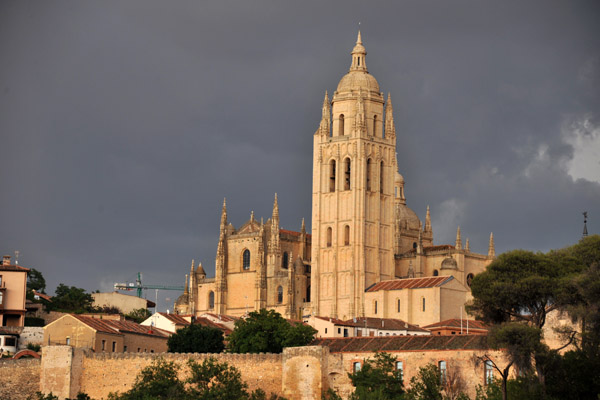The Cathedral of Segovia illuminated by a ray of sunlight on an otherwise cloudy day