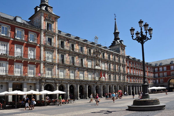 Plaza Mayor of Madrid with bronze reliefs around the base of the lamps