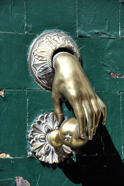 Door knocker of a hand holding an apple, Madrid