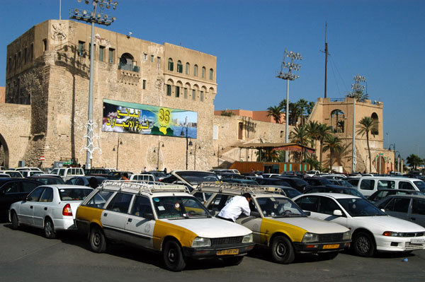 Taxis parked on Martyr's Square in front of Tripoli Castle