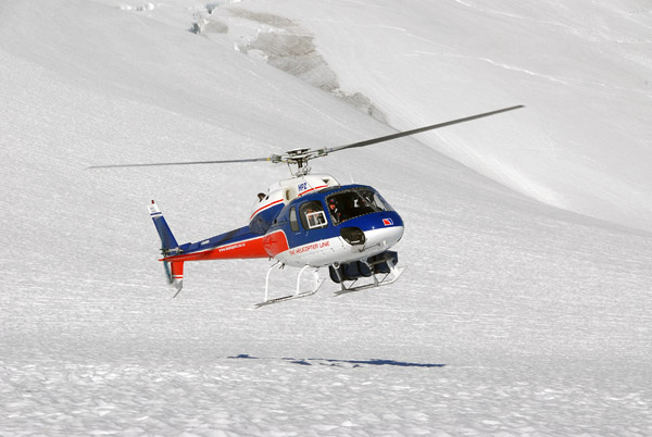 Helicopter landing on Fox Glacier