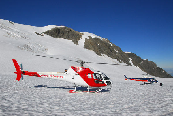 A pair of helicopters on Fox Glacier