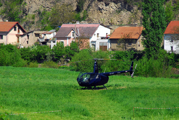 HeliCzech Robinson R44 (OK-HCZ) in the grass near Karlštejn Station