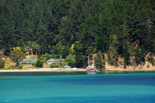 Nice boat moored in front of a small settlement