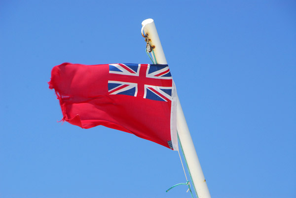 Wind-ripped British maritime flag