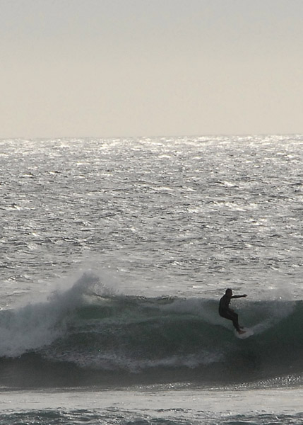 Surfer off Cape Egmont