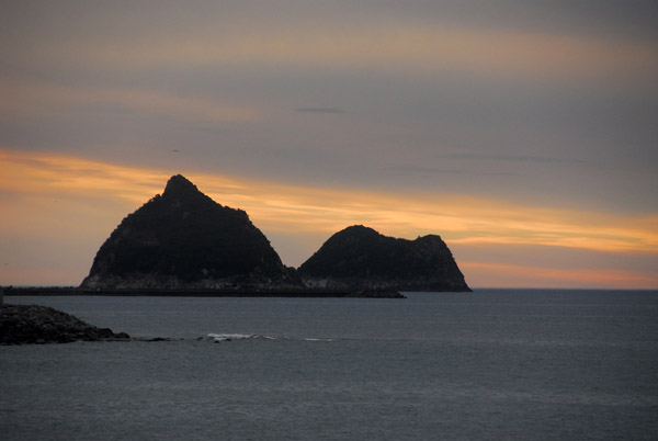 Sunset with small rocky islands off the coast of New Plymouth