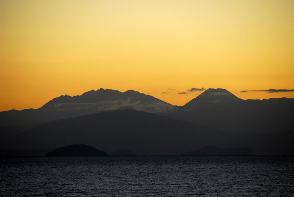 Sunset over Lake Taupo with the Tongariro volcanoes