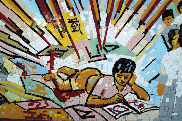 Boy studying on the Bangla Academy wall mosaic