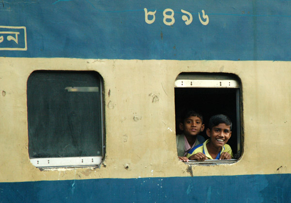 Friendly Bangladeshis looking out the window of a train, Dhaka