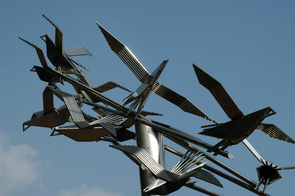 Modern metal sculpture of birds in flight, Teacher-Student Center, Dhaka University