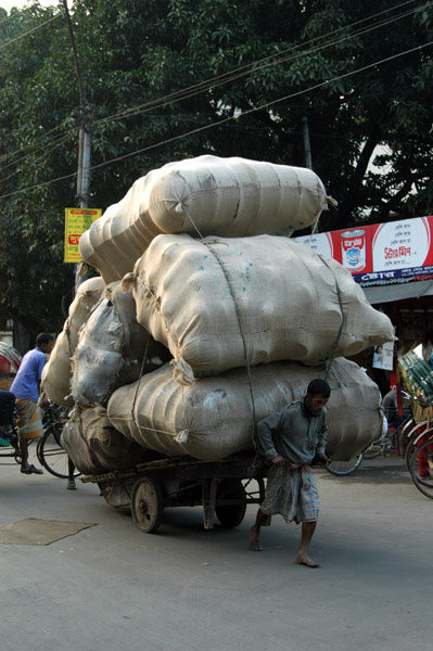 A very small man pulling a very big load, Dhaka