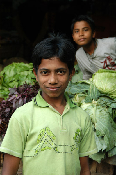 Boy in green matching the produce, Dhaka