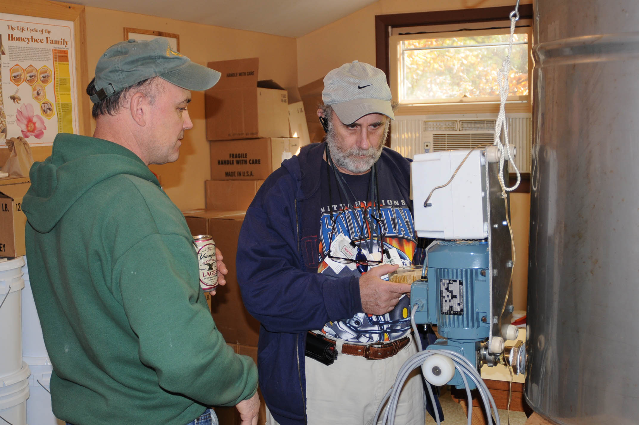 Herman explains his bottling machine to Dr. Roeshman